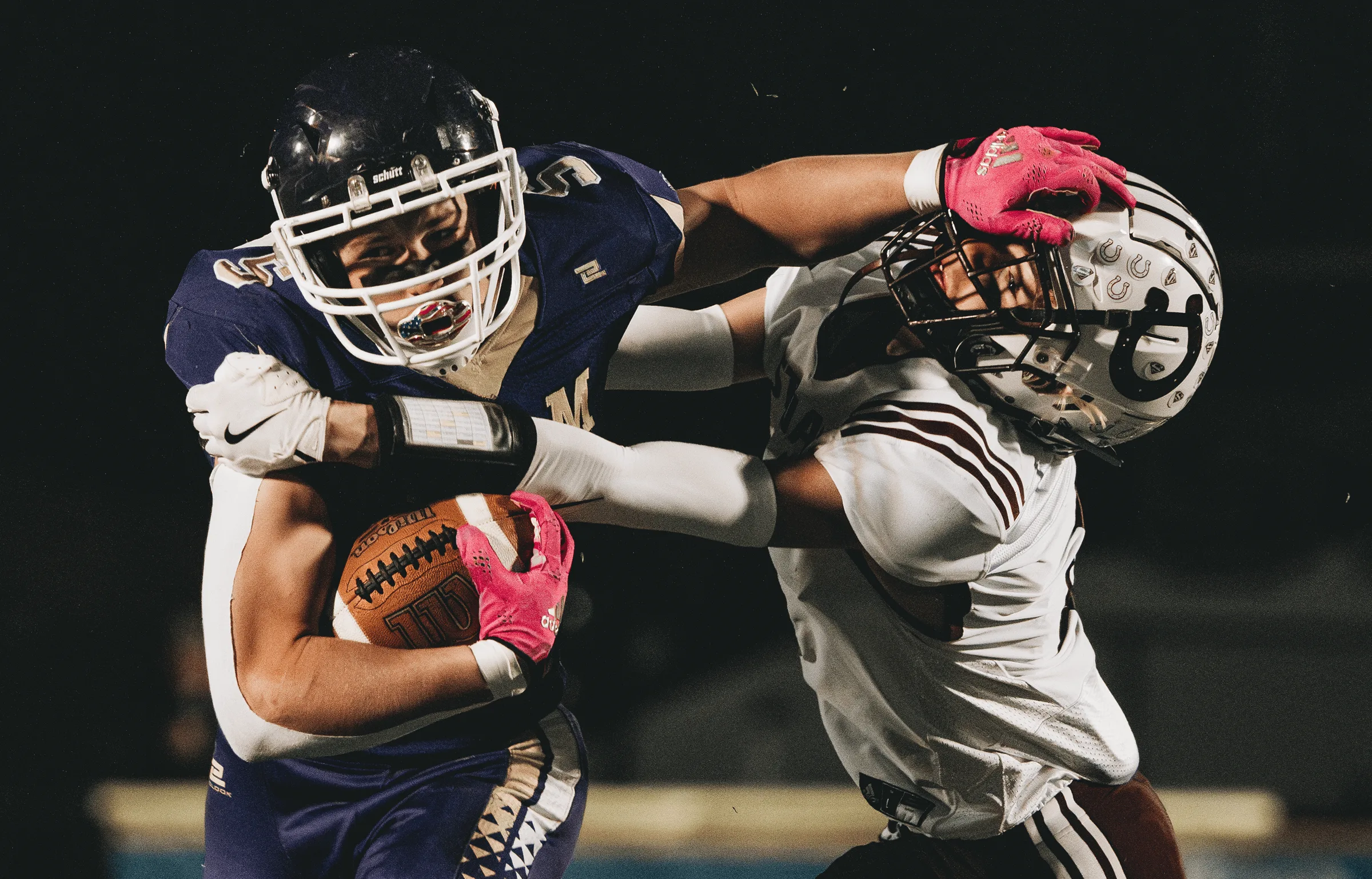A Sumner-Eddyville-Miller ball carrier delivers a stiff-arm to a Stuart defender.