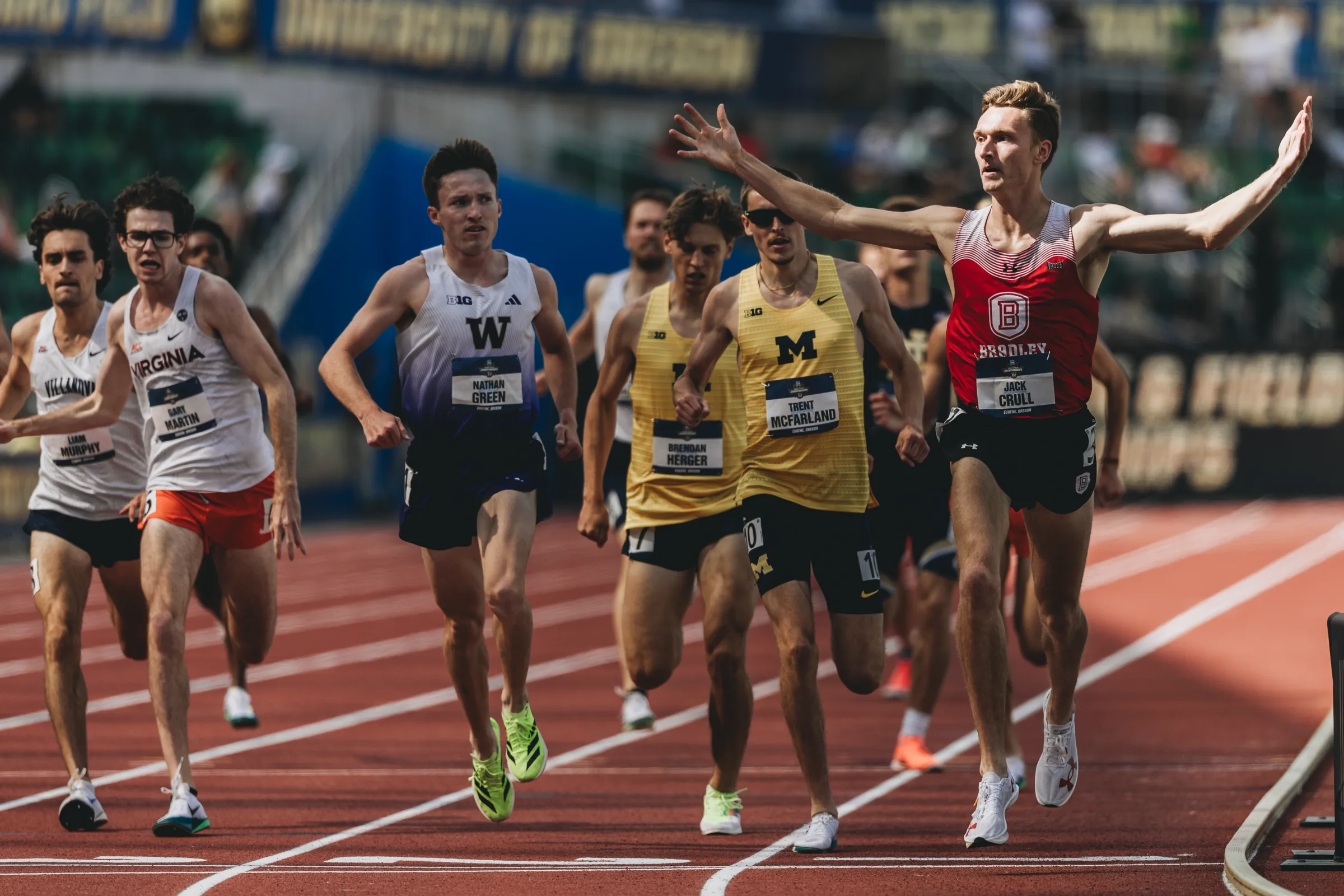 Bradley University's Jack Crull spreads his arms wide as he crosses the finish line to win his semifinal heat in the men's 1,500 meters at the NCAA Outdoor Track and Field Championships at Hayward Field in Eugene, Ore. Crull, who entered the meet ranked 85th nationally, won his heat in 3:51.96 on June 11, 2025, and went on to finish sixth in the final to earn First Team All-American honors, the first for a Bradley male athlete in more than 70 years.