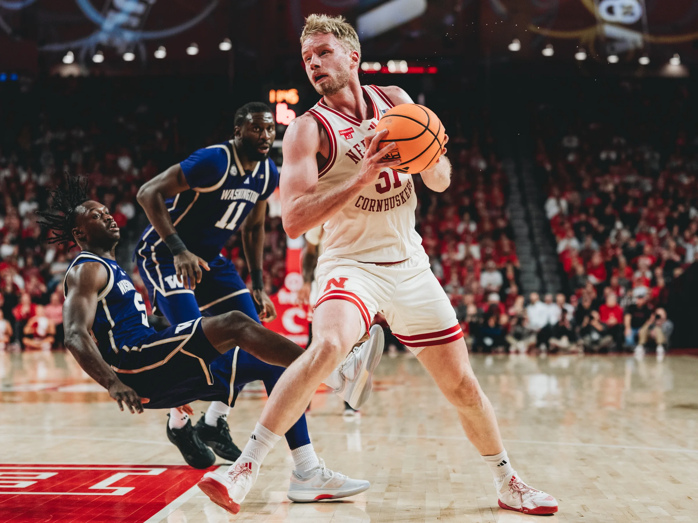 Nebraska Cornhuskers senior forward Rienk Mast (51) spins past a Washington Huskies defender on a drive to the basket at Pinnacle Bank Arena in Lincoln, Nebraska. The Cornhuskers defeated the Huskies 76-66 on Wednesday, Jan. 21, 2026, extending Nebraska's winning streak to 23 games.